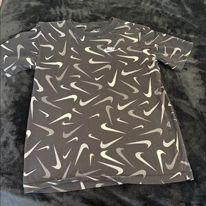 Nike Kids Black Tee with White Swoosh Pattern